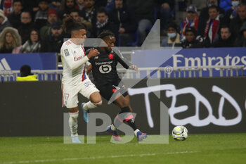 27/02/2022 - Renato LUZ SANCHES of Lille and Malo GUSTO of Lyon during the French championship Ligue 1 football match between Olympique Lyonnais (Lyon) and LOSC Lille on February 27, 2022 at Groupama stadium in Decines-Charpieu near Lyon, France - OLYMPIQUE LYONNAIS (LYON) VS LOSC LILLE - FRENCH LIGUE 1 - CALCIO