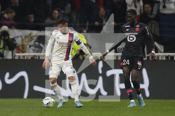 27/02/2022 - Houssem AOUAR of Lyon and Amadou MVOM ONANA of Lille during the French championship Ligue 1 football match between Olympique Lyonnais (Lyon) and LOSC Lille on February 27, 2022 at Groupama stadium in Decines-Charpieu near Lyon, France - OLYMPIQUE LYONNAIS (LYON) VS LOSC LILLE - FRENCH LIGUE 1 - CALCIO