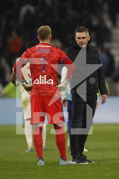 27/02/2022 - Jocelyn GOURVENNEC coach of Lille and Anthony LOPES of Lyon during the French championship Ligue 1 football match between Olympique Lyonnais (Lyon) and LOSC Lille on February 27, 2022 at Groupama stadium in Decines-Charpieu near Lyon, France - OLYMPIQUE LYONNAIS (LYON) VS LOSC LILLE - FRENCH LIGUE 1 - CALCIO