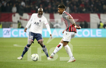 2022-03-05 - Mario Lemina of Nice, Danilo Pereira of PSG (left) during the French championship Ligue 1 football match between OGC Nice (OGCN) and Paris Saint-Germain (PSG) on March 5, 2022 at Allianz Riviera stadium in Nice, France - OGC NICE (OGCN) VS PARIS SAINT-GERMAIN (PSG) - FRENCH LIGUE 1 - SOCCER