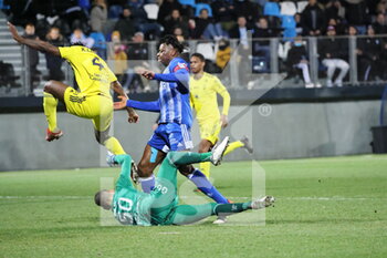12/03/2022 - Action Malik Tchokounte 18 Dunkerque and goalkeeper Pau Stéfan Bajic 50 during the French championship Ligue 2 football match between USL Dunkerque and Pau FC on March 12, 2022 at Marcel Tribut stadium in Dunkerque, France - USL DUNKERQUE VS PAU FC - FRENCH LIGUE 1 - CALCIO