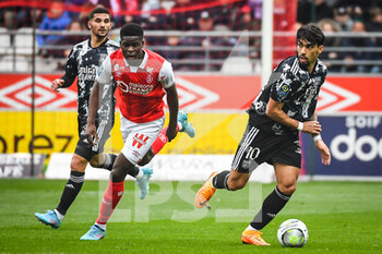 2022-03-20 - Houssem AOUAR of Lyon, Marshall MUNETSI of Reims and Lucas PAQUETA of Lyon during the French championship Ligue 1 football match between Stade de Reims and Olympique Lyonnais on March 20, 2022 at Auguste Delaune stadium in Reims, France - STADE DE REIMS VS OLYMPIQUE LYONNAIS - FRENCH LIGUE 1 - SOCCER