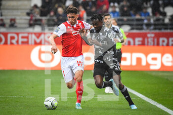 2022-03-20 - Maxime BUSI of Reims and Tino KADEWERE of Lyon during the French championship Ligue 1 football match between Stade de Reims and Olympique Lyonnais on March 20, 2022 at Auguste Delaune stadium in Reims, France - STADE DE REIMS VS OLYMPIQUE LYONNAIS - FRENCH LIGUE 1 - SOCCER