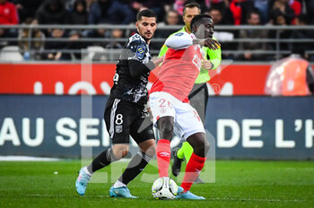 2022-03-20 - Houssem AOUAR of Lyon and Dion LOPY of Reims during the French championship Ligue 1 football match between Stade de Reims and Olympique Lyonnais on March 20, 2022 at Auguste Delaune stadium in Reims, France - STADE DE REIMS VS OLYMPIQUE LYONNAIS - FRENCH LIGUE 1 - SOCCER