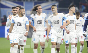 20/03/2022 - Dimitri Payet, Matteo Guendouzi, William Saliba, Arkadiusz Milik of Marseille and teammates celebrate the victory with their supporters following the French championship Ligue 1 football match between Olympique de Marseille and OGC Nice on March 20, 2022 at Velodrome stadium in Marseille, France - OLYMPIQUE DE MARSEILLE VS OGC NICE - FRENCH LIGUE 1 - CALCIO