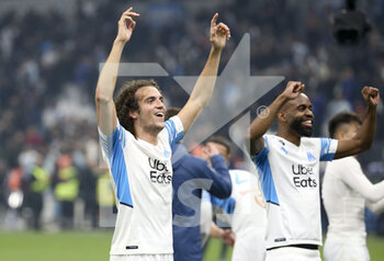 20/03/2022 - Matteo Guendouzi, Cedric Bakambu of Marseille celebrate the victory following the French championship Ligue 1 football match between Olympique de Marseille and OGC Nice on March 20, 2022 at Velodrome stadium in Marseille, France - OLYMPIQUE DE MARSEILLE VS OGC NICE - FRENCH LIGUE 1 - CALCIO