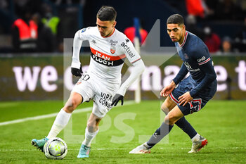 03/04/2022 - Enzo LE FEE of Lorient and Achraf HAKIMI of PSG during the French championship Ligue 1 football match between Paris Saint-Germain and FC Lorient on April 3, 2022 at Parc des Princes stadium in Paris, France - PARIS SAINT-GERMAIN VS FC LORIENT - FRENCH LIGUE 1 - CALCIO
