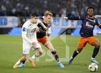 10/04/2022 - Cengiz Under of Marseille, Nicolas Cozza of Montpellier during the French championship Ligue 1 football match between Olympique de Marseille (OM) and Montpellier HSC (MHSC) on April 10, 2022 at Stade Velodrome in Marseille, France - OLYMPIQUE DE MARSEILLE (OM) VS MONTPELLIER HSC (MHSC) - FRENCH LIGUE 1 - CALCIO