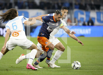 10/04/2022 - Teji Savanier of Montpellier, William Saliba of Marseille during the French championship Ligue 1 football match between Olympique de Marseille (OM) and Montpellier HSC (MHSC) on April 10, 2022 at Stade Velodrome in Marseille, France - OLYMPIQUE DE MARSEILLE (OM) VS MONTPELLIER HSC (MHSC) - FRENCH LIGUE 1 - CALCIO