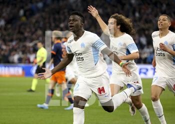 10/04/2022 - Bamba Dieng of Marseille celebrates his goal with Matteo Guendouzi, Amine Harit during the French championship Ligue 1 football match between Olympique de Marseille (OM) and Montpellier HSC (MHSC) on April 10, 2022 at Stade Velodrome in Marseille, France - OLYMPIQUE DE MARSEILLE (OM) VS MONTPELLIER HSC (MHSC) - FRENCH LIGUE 1 - CALCIO