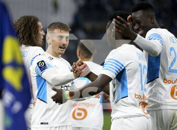 10/04/2022 - Bamba Dieng of Marseille celebrates his goal with Valentin Rongier (left), Pape Gueye during the French championship Ligue 1 football match between Olympique de Marseille (OM) and Montpellier HSC (MHSC) on April 10, 2022 at Stade Velodrome in Marseille, France - OLYMPIQUE DE MARSEILLE (OM) VS MONTPELLIER HSC (MHSC) - FRENCH LIGUE 1 - CALCIO