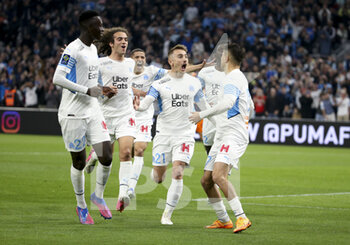 10/04/2022 - Cengiz Under of Marseille (far right) celebrates his goal on a penalty kick with Matteo Guendouzi, Amine Harit, Valentin Rongier of Marseille during the French championship Ligue 1 football match between Olympique de Marseille (OM) and Montpellier HSC (MHSC) on April 10, 2022 at Stade Velodrome in Marseille, France - OLYMPIQUE DE MARSEILLE (OM) VS MONTPELLIER HSC (MHSC) - FRENCH LIGUE 1 - CALCIO