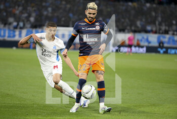 10/04/2022 - Remi Cabella of Montpellier, Amine Harit of Marseille (left) during the French championship Ligue 1 football match between Olympique de Marseille (OM) and Montpellier HSC (MHSC) on April 10, 2022 at Stade Velodrome in Marseille, France - OLYMPIQUE DE MARSEILLE (OM) VS MONTPELLIER HSC (MHSC) - FRENCH LIGUE 1 - CALCIO
