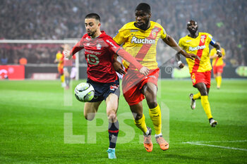 2022-04-16 - Edon ZHEGROVA of Lille and Kevin DANSO of Lens during the French championship Ligue 1 football match between LOSC Lille and RC Lens on April 16, 2022 at Pierre Mauroy stadium in Villeneuve-d'Ascq near Lille, France - LOSC LILLE VS RC LENS - FRENCH LIGUE 1 - SOCCER