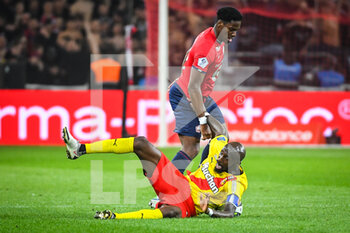 2022-04-16 - Seko FOFANA of Lens and Jonathan DAVID of Lille during the French championship Ligue 1 football match between LOSC Lille and RC Lens on April 16, 2022 at Pierre Mauroy stadium in Villeneuve-d'Ascq near Lille, France - LOSC LILLE VS RC LENS - FRENCH LIGUE 1 - SOCCER