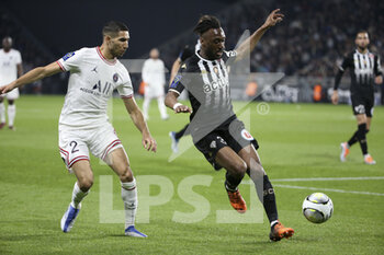 2022-04-20 - Achraf Hakimi of PSG, Souleyman Doumbia of Angers during the French championship Ligue 1 football match between SCO Angers and Paris Saint-Germain on April 20, 2022 at Raymond Kopa stadium in Angers, France - SCO ANGERS VS PARIS SAINT-GERMAIN - FRENCH LIGUE 1 - SOCCER