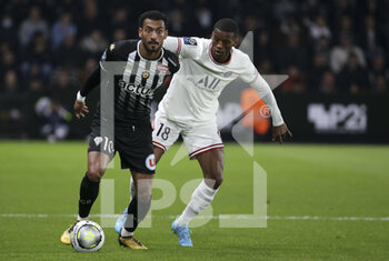 2022-04-20 - Angelo Fulgini of Angers, Georginio Wijnaldum of PSG during the French championship Ligue 1 football match between SCO Angers and Paris Saint-Germain on April 20, 2022 at Raymond Kopa stadium in Angers, France - SCO ANGERS VS PARIS SAINT-GERMAIN - FRENCH LIGUE 1 - SOCCER