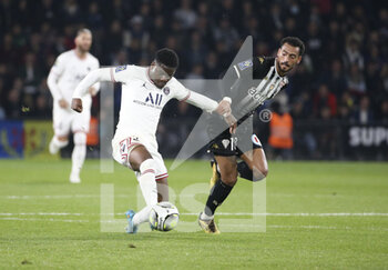 2022-04-20 - Eric Junior Dina-Ebimbe of PSG, Angelo Fulgini of Angers during the French championship Ligue 1 football match between SCO Angers and Paris Saint-Germain on April 20, 2022 at Raymond Kopa stadium in Angers, France - SCO ANGERS VS PARIS SAINT-GERMAIN - FRENCH LIGUE 1 - SOCCER