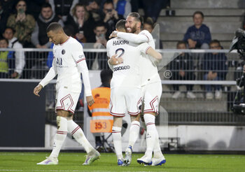 2022-04-20 - Sergio Ramos of PSG (right) celebrates his goal with Achraf Hakimi, Kylian Mbappe during the French championship Ligue 1 football match between SCO Angers and Paris Saint-Germain on April 20, 2022 at Raymond Kopa stadium in Angers, France - SCO ANGERS VS PARIS SAINT-GERMAIN - FRENCH LIGUE 1 - SOCCER