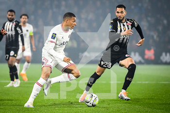 2022-04-20 - Kylian MBAPPE of PSG and Antonin BOBICHON of Angers during the French championship Ligue 1 football match between SCO Angers and Paris Saint-Germain on April 20, 2022 at Raymond Kopa stadium in Angers, France - SCO ANGERS VS PARIS SAINT-GERMAIN - FRENCH LIGUE 1 - SOCCER