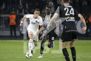 2022-04-20 - Thilo Kehrer of PSG, Batista Mendy of Angers during the French championship Ligue 1 football match between SCO Angers and Paris Saint-Germain on April 20, 2022 at Raymond Kopa stadium in Angers, France - SCO ANGERS VS PARIS SAINT-GERMAIN - FRENCH LIGUE 1 - SOCCER
