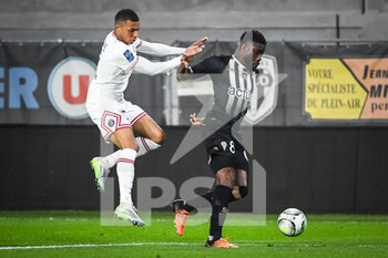 2022-04-20 - Kylian MBAPPE of PSG and Ismael TRAORE of Angers during the French championship Ligue 1 football match between SCO Angers and Paris Saint-Germain on April 20, 2022 at Raymond Kopa stadium in Angers, France - SCO ANGERS VS PARIS SAINT-GERMAIN - FRENCH LIGUE 1 - SOCCER