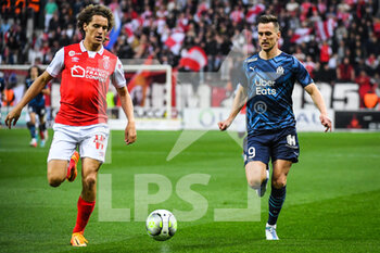 2022-04-24 - Wout FAES of Reims and Arkadiusz MILIK of Marseille during the French championship Ligue 1 football match between Stade de Reims and Olympique de Marseille on April 24, 2022 at Auguste Delaune stadium in Reims, France - STADE DE REIMS VS OLYMPIQUE DE MARSEILLE - FRENCH LIGUE 1 - SOCCER