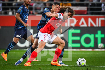 2022-04-24 - Amine HARIT of Marseille and Wout FAES of Reims during the French championship Ligue 1 football match between Stade de Reims and Olympique de Marseille on April 24, 2022 at Auguste Delaune stadium in Reims, France - STADE DE REIMS VS OLYMPIQUE DE MARSEILLE - FRENCH LIGUE 1 - SOCCER