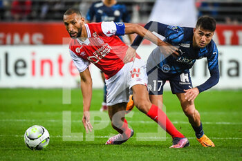 2022-04-24 - Yunis ABDELHAMID of Reims and Cengiz UNDER of Marseille during the French championship Ligue 1 football match between Stade de Reims and Olympique de Marseille on April 24, 2022 at Auguste Delaune stadium in Reims, France - STADE DE REIMS VS OLYMPIQUE DE MARSEILLE - FRENCH LIGUE 1 - SOCCER
