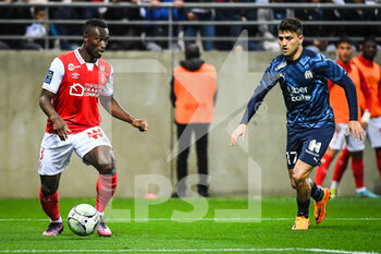 2022-04-24 - Ghislain KONAN of Reims and Cengiz UNDER of Marseille during the French championship Ligue 1 football match between Stade de Reims and Olympique de Marseille on April 24, 2022 at Auguste Delaune stadium in Reims, France - STADE DE REIMS VS OLYMPIQUE DE MARSEILLE - FRENCH LIGUE 1 - SOCCER