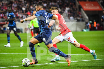 2022-04-24 - Dimitri PAYET of Marseille and Thomas FOKET of Reims during the French championship Ligue 1 football match between Stade de Reims and Olympique de Marseille on April 24, 2022 at Auguste Delaune stadium in Reims, France - STADE DE REIMS VS OLYMPIQUE DE MARSEILLE - FRENCH LIGUE 1 - SOCCER