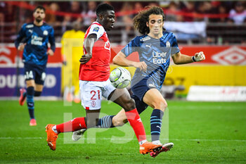 2022-04-24 - Azor MATUSIWA of Reims and Matteo GUENDOUZI of Marseille during the French championship Ligue 1 football match between Stade de Reims and Olympique de Marseille on April 24, 2022 at Auguste Delaune stadium in Reims, France - STADE DE REIMS VS OLYMPIQUE DE MARSEILLE - FRENCH LIGUE 1 - SOCCER