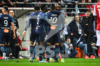 2022-04-24 - Gerson of Marseille celebrate his goal with Dimitri PAYET of Marseille during the French championship Ligue 1 football match between Stade de Reims and Olympique de Marseille on April 24, 2022 at Auguste Delaune stadium in Reims, France - STADE DE REIMS VS OLYMPIQUE DE MARSEILLE - FRENCH LIGUE 1 - SOCCER