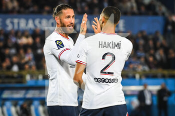 29/04/2022 - Achraf HAKIMI of PSG celebrate his goal with Sergio RAMOS of PSG during the French championship Ligue 1 football match between RC Strasbourg and Paris Saint-Germain on April 29, 2022 at La Meinau stadium in Strasbourg, France - RC STRASBOURG VS PARIS SAINT-GERMAIN - FRENCH LIGUE 1 - CALCIO