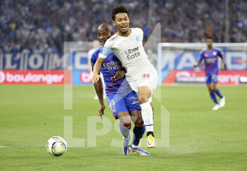 2022-05-01 - Boubacar Kamara of Marseille, Moussa Dembele of Lyon (left) during the French championship Ligue 1 football match between Olympique de Marseille (OM) and Olympique Lyonnais (OL, Lyon) on May 1, 2022 at Stade Velodrome in Marseille, France - OLYMPIQUE DE MARSEILLE (OM) VS OLYMPIQUE LYONNAIS (OL, LYON) - FRENCH LIGUE 1 - SOCCER