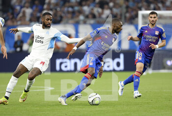 2022-05-01 - Karl Toko Ekambi of Lyon, Gerson Santos da Silva of Marseille (left) during the French championship Ligue 1 football match between Olympique de Marseille (OM) and Olympique Lyonnais (OL, Lyon) on May 1, 2022 at Stade Velodrome in Marseille, France - OLYMPIQUE DE MARSEILLE (OM) VS OLYMPIQUE LYONNAIS (OL, LYON) - FRENCH LIGUE 1 - SOCCER