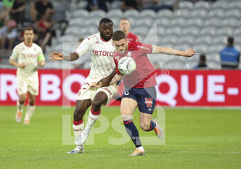 2022-05-06 - Gabriel Gudmundsson of Lille, Youssouf Fofana of Monaco (left) during the French championship Ligue 1 football match between Lille OSC (LOSC) and AS Monaco (ASM) on May 6, 2022 at Stade Pierre Mauroy in Villeneuve d'Ascq near Lille, France - LOSC LILLE VS AS MONACO - FRENCH LIGUE 1 - SOCCER