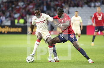 2022-05-06 - Youssouf Fofana of Monaco, Amadou Onana of Lille during the French championship Ligue 1 football match between Lille OSC (LOSC) and AS Monaco (ASM) on May 6, 2022 at Stade Pierre Mauroy in Villeneuve d'Ascq near Lille, France - LOSC LILLE VS AS MONACO - FRENCH LIGUE 1 - SOCCER