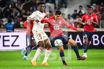 2022-05-06 - Aurelien TCHOUAMENI of Monaco and Benjamin ANDRE of Lille during the French championship Ligue 1 football match between LOSC Lille and AS Monaco on May 6, 2022 at Pierre Mauroy stadium in Villeneuve-d'Ascq near Lille, France - LOSC LILLE VS AS MONACO - FRENCH LIGUE 1 - SOCCER