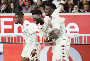 2022-05-06 - Aurelien Tchouameni of Monaco celebrates his winning goal with Benoit Badiashile (left) during the French championship Ligue 1 football match between Lille OSC (LOSC) and AS Monaco (ASM) on May 6, 2022 at Stade Pierre Mauroy in Villeneuve d'Ascq near Lille, France - LOSC LILLE VS AS MONACO - FRENCH LIGUE 1 - SOCCER