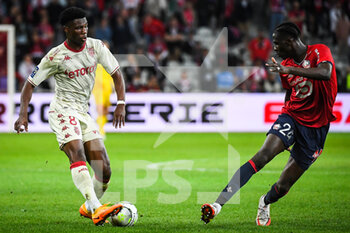 2022-05-06 - Aurelien TCHOUAMENI of Monaco and Amadou ONANA of Lille during the French championship Ligue 1 football match between LOSC Lille and AS Monaco on May 6, 2022 at Pierre Mauroy stadium in Villeneuve-d'Ascq near Lille, France - LOSC LILLE VS AS MONACO - FRENCH LIGUE 1 - SOCCER