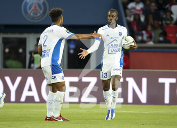 08/05/2022 - Ike Dominique Ugbo of Troyes celebrates his goal with Erik Palmer-Brown of Troyes (left) during the French championship Ligue 1 football match between Paris Saint-Germain and ESTAC Troyes on May 8, 2022 at Parc des Princes stadium in Paris, France - PARIS SAINT-GERMAIN VS ESTAC TROYES - FRENCH LIGUE 1 - CALCIO