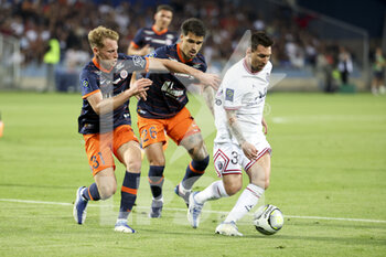2022-05-14 - Lionel Messi of PSG, left Nicolas Cozza, Matheus Thuler of Montpellier during the French championship Ligue 1 football match between Montpellier HSC and Paris Saint-Germain on May 14, 2022 at La Mosson stadium in Montpellier, France - MONTPELLIER HSC VS PARIS SAINT-GERMAIN - FRENCH LIGUE 1 - SOCCER