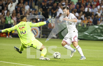 2022-05-14 - Lionel Messi of PSG scores his goal despite goalkeeper of Montpellier Dimitry Bertaud during the French championship Ligue 1 football match between Montpellier HSC and Paris Saint-Germain on May 14, 2022 at La Mosson stadium in Montpellier, France - MONTPELLIER HSC VS PARIS SAINT-GERMAIN - FRENCH LIGUE 1 - SOCCER