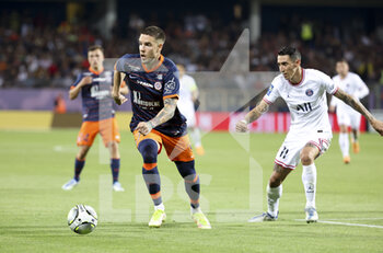 2022-05-14 - Mihailo Ristic of Montpellier, Angel Di Maria of PSG during the French championship Ligue 1 football match between Montpellier HSC and Paris Saint-Germain on May 14, 2022 at La Mosson stadium in Montpellier, France - MONTPELLIER HSC VS PARIS SAINT-GERMAIN - FRENCH LIGUE 1 - SOCCER