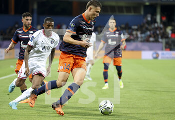 2022-05-14 - Maxime Esteve of Montpellier, Georginio Wijnaldum of PSG (left) during the French championship Ligue 1 football match between Montpellier HSC and Paris Saint-Germain on May 14, 2022 at La Mosson stadium in Montpellier, France - MONTPELLIER HSC VS PARIS SAINT-GERMAIN - FRENCH LIGUE 1 - SOCCER