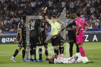 05/08/2022 - Referee Benoit BASTIEN and Cedric AVINEL of Ajaccio yellow card during the French championship Ligue 1 football match between Olympique Lyonnais (Lyon) and AC Ajaccio on August 5, 2022 at Groupama stadium in Decines-Charpieu near Lyon, France - FOOTBALL - FRENCH CHAMP - LYON V AJACCIO - FRENCH LIGUE 1 - CALCIO