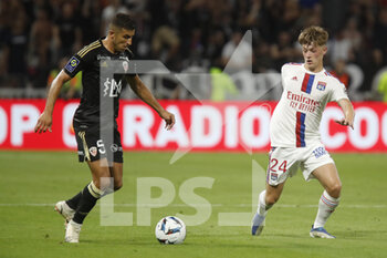 05/08/2022 - Riad NOURI of Ajaccio and Johann LEPENANT of Lyon during the French championship Ligue 1 football match between Olympique Lyonnais (Lyon) and AC Ajaccio on August 5, 2022 at Groupama stadium in Decines-Charpieu near Lyon, France - FOOTBALL - FRENCH CHAMP - LYON V AJACCIO - FRENCH LIGUE 1 - CALCIO