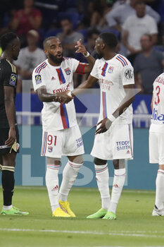 05/08/2022 - Alexandre LACAZETTE of Lyon and Karl TOKO EKAMBI of Lyon during the French championship Ligue 1 football match between Olympique Lyonnais (Lyon) and AC Ajaccio on August 5, 2022 at Groupama stadium in Decines-Charpieu near Lyon, France - FOOTBALL - FRENCH CHAMP - LYON V AJACCIO - FRENCH LIGUE 1 - CALCIO