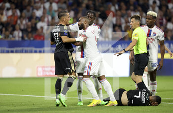 05/08/2022 - Romain Hamouma of Ajaccio argues with Alexandre Lacazette of Lyon, both will receive a yellow card, during the French championship Ligue 1 football match between Olympique Lyonnais (OL) and AC Ajaccio (ACA) on August 5, 2022 at Groupama Stadium in Decines-Charpieu near Lyon, France - FOOTBALL - FRENCH CHAMP - LYON V AJACCIO - FRENCH LIGUE 1 - CALCIO